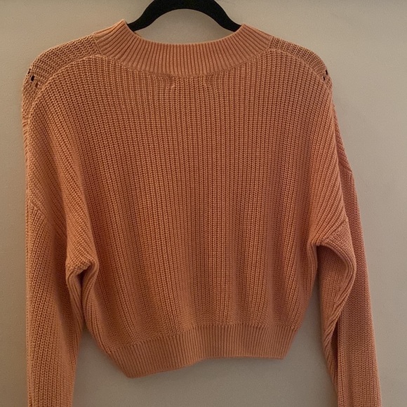 A coral sweater. - Picture 3 of 3